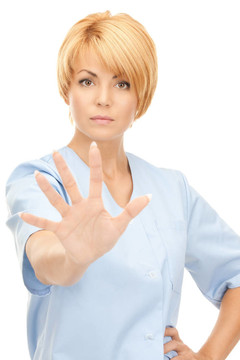 迷人的女醫(yī)生顯示停止手勢