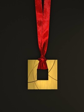 在黑暗背景上帶紅絲帶的金質(zhì)獎(jiǎng)?wù)? style=