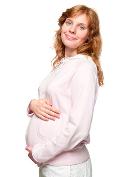 年輕的孕婦把手放在肚子上
