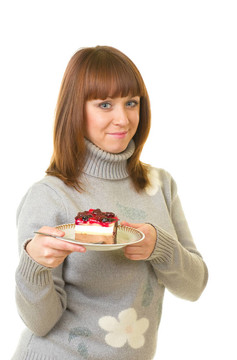 年輕女人吃美味蛋糕