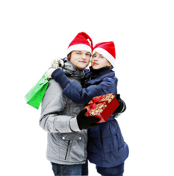 Santa帽子戶外送禮年輕夫婦孤立在白色吸引人