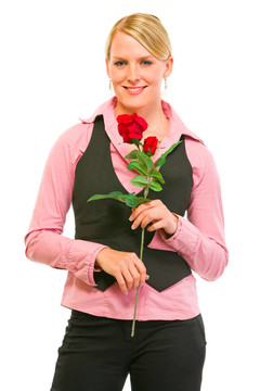 微笑的現(xiàn)代商業(yè)女性手持紅玫瑰