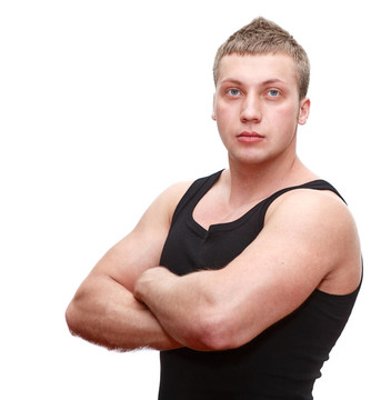一個英俊的白人男子在黑色T恤musculan雙手對乳腺孤立在白色背景