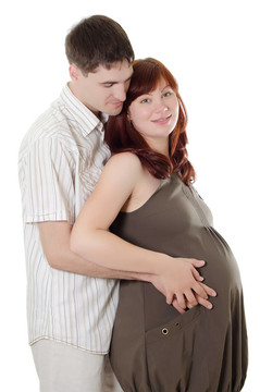 幸福懷孕夫婦孤立在白色