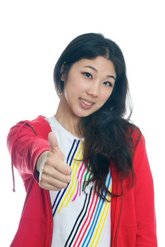 年輕的中國女孩豎起大拇指