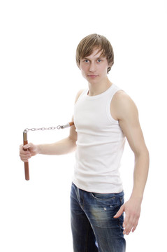 武術(shù)。人與nunchucks。白色隔離。