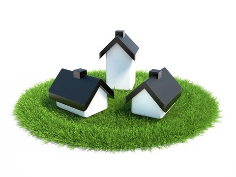 房子位于草地上象征著房屋建設(shè)用地
