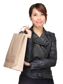 帶購(gòu)物紙袋的婦女