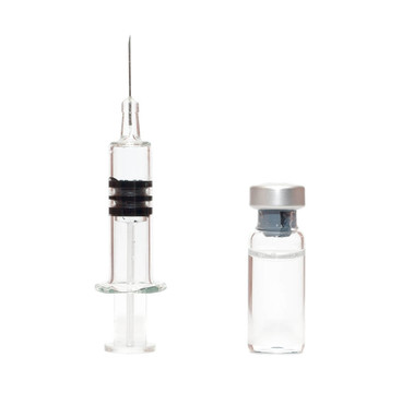 在白色的注射器和小瓶