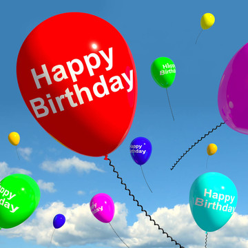 五彩的气球在天空中庆祝一个快乐的岁生日娃娃
