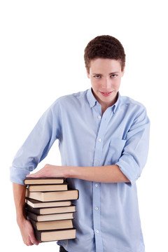 年輕漂亮的男孩；手里拿著書；白色背景上孤立。工作室拍攝