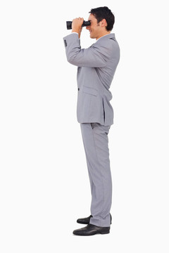 一個(gè)商人使用雙筒望遠(yuǎn)鏡的簡(jiǎn)介