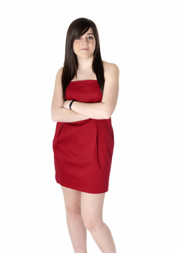 年輕女子美麗與紅衣服孤立在白色。