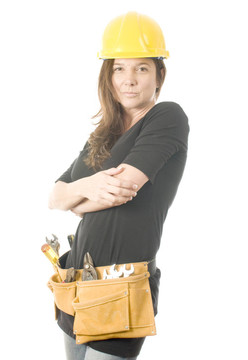 女女承包商建設(shè)者與保護(hù)帽頭盔和工具帶工具