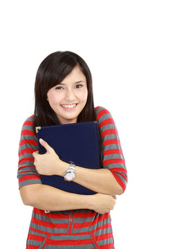 年輕的學(xué)生拿著bookwith快樂的臉