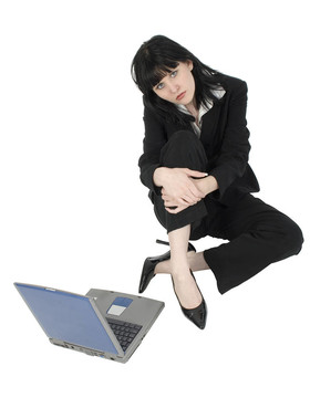 商業(yè)女人與筆記本電腦