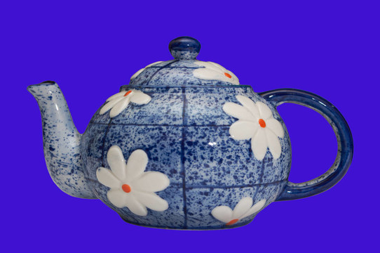 黑色背景上的藍(lán)色茶壺