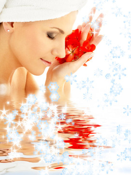 夫人與紅色的花瓣和雪花在水中