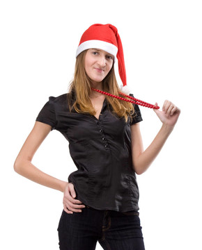 漂亮的女孩在紅色的圣誕老人帽