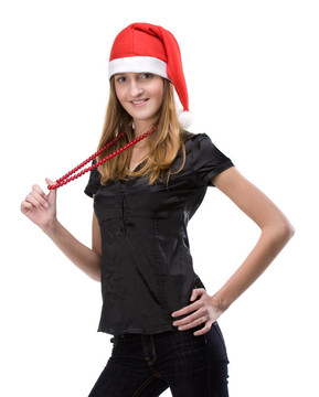 漂亮的女孩在紅色的圣誕老人帽