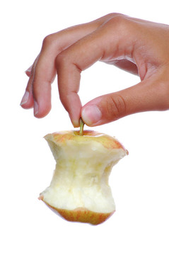 用莖的女性手拿蘋(píng)果芯