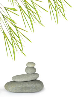 灰色溫泉治療石完美平衡與竹葉草；白色背景。