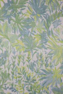紡織背景的綠色；藍色和黃色葉飾品