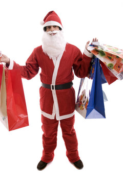 年輕人在Santa服裝；充滿了禮物