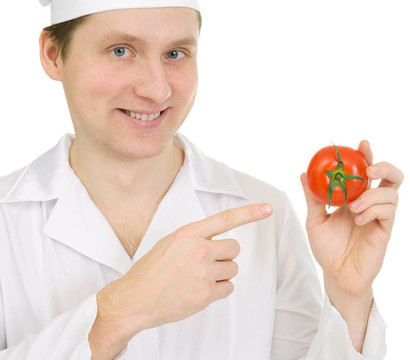 Cook手上的西紅柿