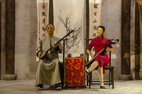 清代藝人彈唱場景