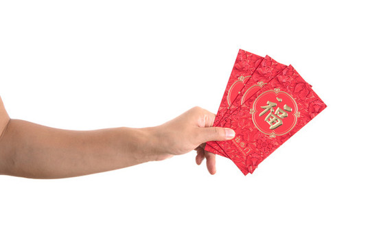 白背景前一只手拿著節(jié)日的紅包