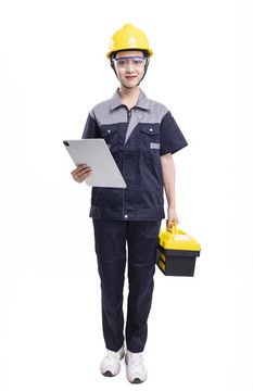 穿著工服提著工具箱的女性工人