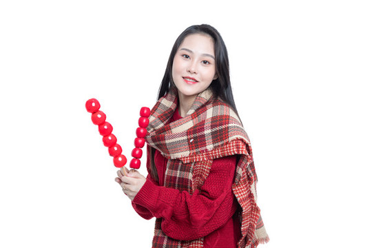 手持冰糖葫蘆的年輕女性
