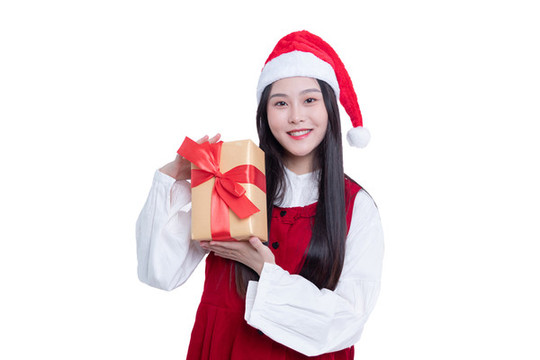 圣誕節(jié)拿著禮盒的年輕女性
