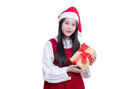 圣誕節(jié)拿著禮盒的年輕女性
