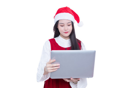 圣誕節(jié)女孩手持筆記本電腦