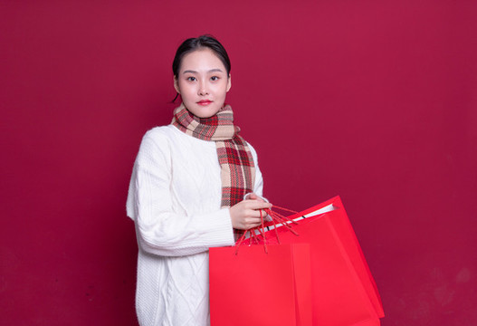 拿著購物袋的美女形象