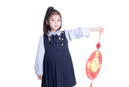 小女孩學(xué)生裝拿著福字的