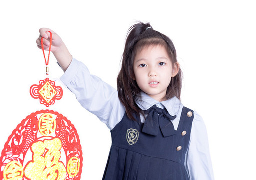 小女孩學(xué)生裝拿著福字的