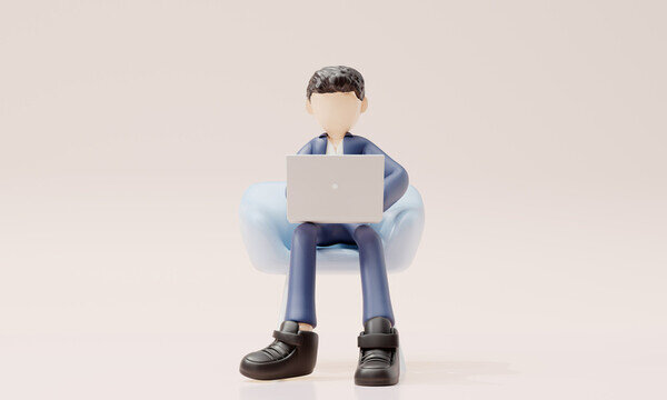 商務(wù)男在沙發(fā)上使用筆記本電腦