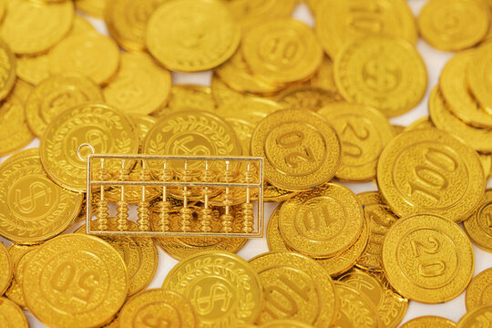 金算盤金幣高清背景圖片