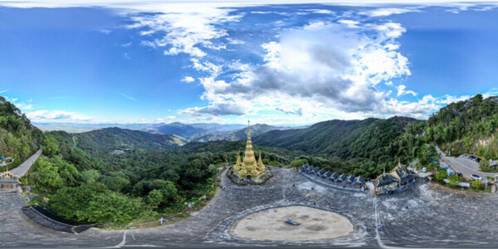 航拍景邁山云霧繚繞的金色佛塔全景
