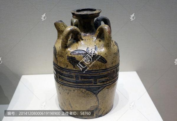 黃釉刻花四系壺,元代