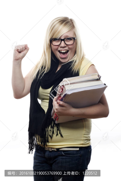 年輕金發(fā)學生興奮與學校書籍
