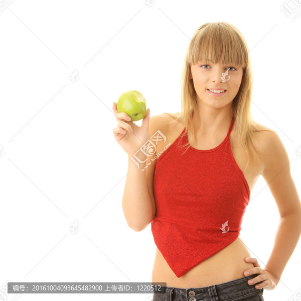 年輕的金發(fā)女人，綠色的蘋果