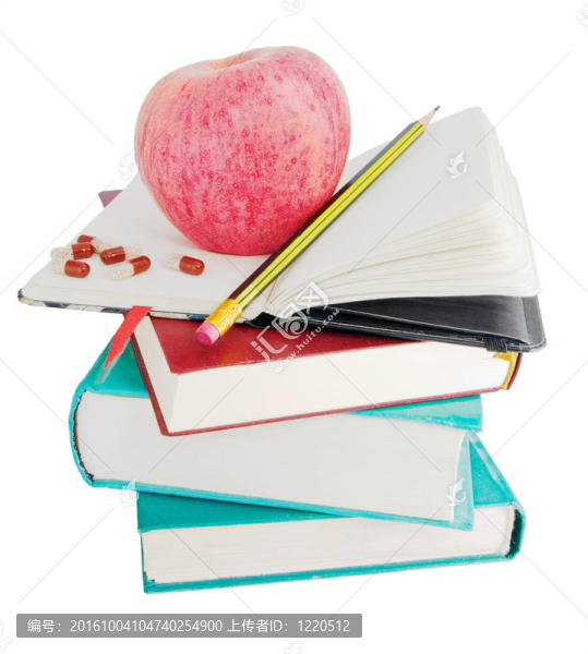 蘋果和藥丸在大堆的書上