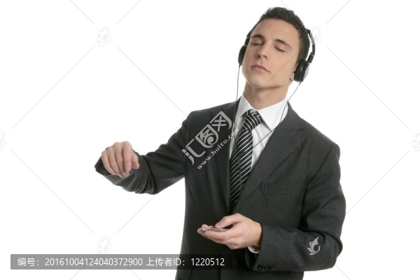 英俊的商人跳舞聽音樂