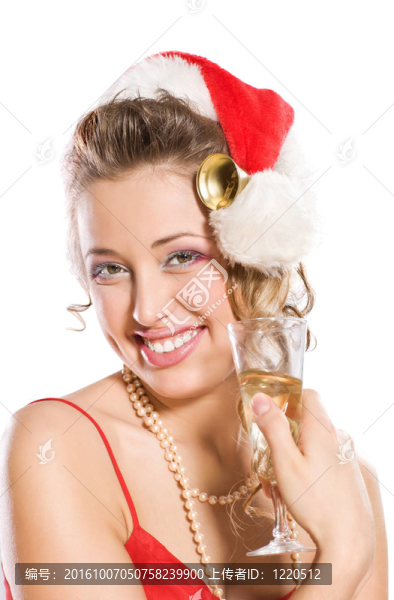 迷人的女孩在Santa與香檳酒杯帽子