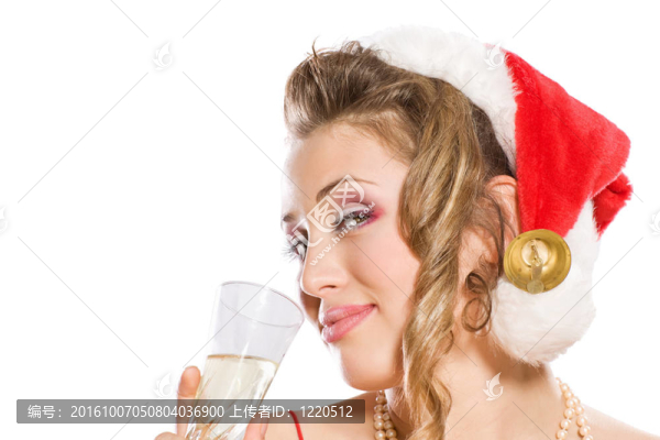 迷人的女孩在Santa與香檳酒杯帽子