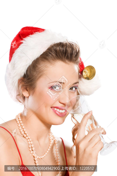 迷人的女孩在Santa與香檳酒杯帽子